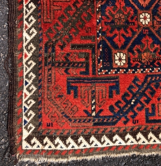 Antique Baluch rug with a delicately drawn lattice design and vine border in overall good condition. Even low pile with oxidized  browns and one penny sized crude patch. Original selvage one  ...