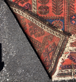 Antique Baluch rug with an interesting uncommon design. A version of the vine border I associate with older examples. In very rough condition but good enough for a study piece. Priced accordingly.  ...