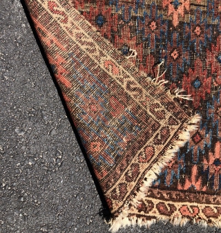 Antique Turkish knotted Baluch rug with an interesting and uncommon design. As found, in rough condition with heavy brown oxidation, wear, edge unraveling, loss. All natural colors. Nice floppy handle. Very dirty.  ...