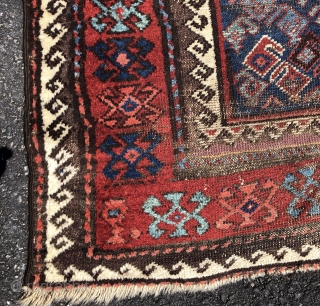 Antique Turkish knotted Baluch rug with an uncommon design and an unusual range of vibrant colors. Lovely multiple reds, light blues and greens. Mostly decent pile but one end has significant heavy  ...