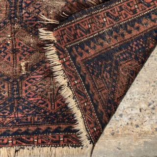 Antique Baluch bagface with classic lattice design. Older example in very worn condition and priced accordingly. Possibly of interest to someone focused on this type. All natural colors. As found in need  ...