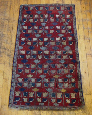 Antique caucasian rug. Another mystery rug. Interesting but very rough condition. Heavy oxidation. Low pile and wear. Edges not original. Small holes. Old burlap backing sewn on and mostly removed. Natural colors?  ...