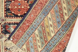 Strange remnant of an old shirvan rug with large areas of light blue cotton pile including most of the minor borders. Never seen anything quite like it before. Bad person cut rug.  ...