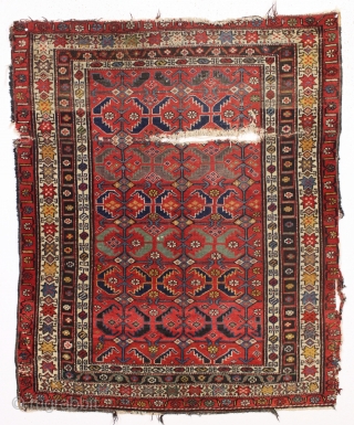 antique northwest persian or kurdish rug. Terrific natural colors including a nice old purple. In very abused condition as shown and priced accordingly. ca. 1890? 4' x 4'9"     