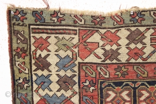 antique long rug, probably nw persian, with an interesting archaic design and older all natural colors. Note the area of white cotton pile seen clearly in back pic. In abused condition, very  ...