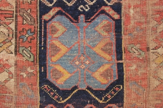 antique long rug, probably nw persian, with an interesting archaic design and older all natural colors. Note the area of white cotton pile seen clearly in back pic. In abused condition, very  ...