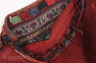 antique complete tribal bag, probably south persian afshar. As found, very very dirty with overall good thick even pile. Pretty greens. Original back, closure tabs and loops. Will need a good was  ...