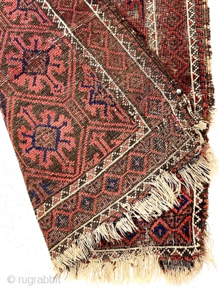 Antique small Baluch rug with a lattice or tile design field and a nearly completely oxidized ground. Good old natural colors. Overall fair condition for an older rug with some good pile.  ...