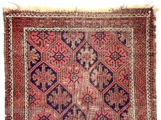 Antique small Baluch rug with a lattice or tile design field and a nearly completely oxidized ground. Good old natural colors. Overall fair condition for an older rug with some good pile.  ...