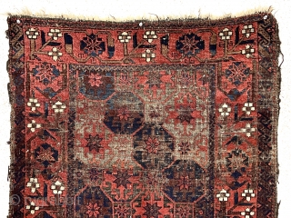 Antique small Baluch rug with classic lattice or tile design field and a lovely archaic floral meander border. Good weave and wool quality. Overall fair condition for an older rug with heavily  ...