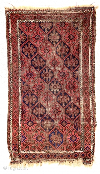 Antique small Baluch rug with a lattice or tile design field and a nearly completely oxidized ground. Good old natural colors. Overall fair condition for an older rug with some good pile.  ...