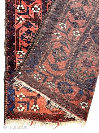Antique small Baluch rug with classic lattice or tile design field and a lovely archaic floral meander border. Good weave and wool quality. Overall fair condition for an older rug with heavily  ...