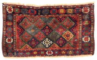 antique jaf kurd bagface with thick high pile and beautiful saturated colors. Highest quality glossy wool. Unusual wide format and an attractive "star" border. All natural colors featuring lovely greens. One of  ...