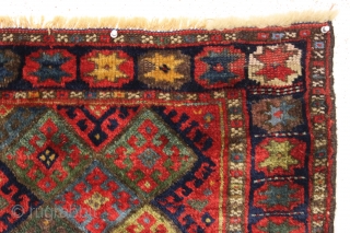 antique jaf kurd bagface with thick high pile and beautiful saturated colors. Highest quality glossy wool. Unusual wide format and an attractive "star" border. All natural colors featuring lovely greens. One of  ...