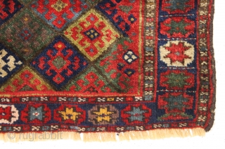 antique jaf kurd bagface with thick high pile and beautiful saturated colors. Highest quality glossy wool. Unusual wide format and an attractive "star" border. All natural colors featuring lovely greens. One of  ...