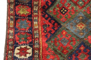 antique jaf kurd bagface with thick high pile and beautiful saturated colors. Highest quality glossy wool. Unusual wide format and an attractive "star" border. All natural colors featuring lovely greens. One of  ...