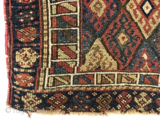 Antique extra large jaf Kurd diamond bagface. Extra rough condition but with a design feature or two worth studying. The bold and large scale colorful “signal flag” border is somewhat uncommon. Note  ...