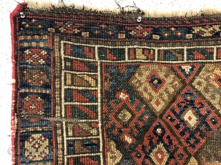 Antique extra large jaf Kurd diamond bagface. Extra rough condition but with a design feature or two worth studying. The bold and large scale colorful “signal flag” border is somewhat uncommon. Note  ...