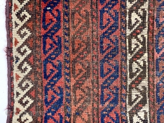 Antique Baluch rug with an interesting striped or cane design. I’ve had a number of striped Baluch rugs but none with this particular design. All good natural colors featuring several reds. Good  ...