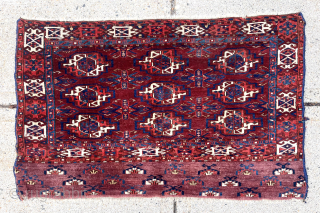 Antique turkman Chuval, possibly Kizil, with classic field and an unusual attractive skirt. Overall excellent conditions with mostly good thick pile. Reasonably clean with saturated natural colors. Multiple reds and deep yellow  ...