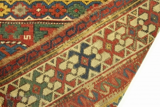 Antique little caucasian rug fragment. Very fine quality and weave. Vibrant natural colors. Corroded ground. Clean but rough as shown. Good age, ca 1880 or earlier. 2'2" x 3'1"    