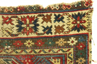 Antique little caucasian rug fragment. Diminutive. Older "keyhole" type. All good natural colors. Rough and dirty condition as shown.  ca. 1875, probably older. 2' x 2'3"      