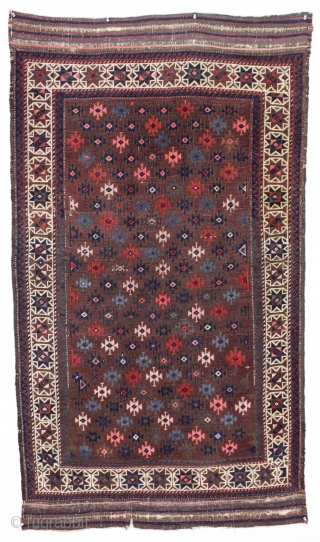 antique baluch rug with very intense color and highest quality weave. Uncommon design. Symmetrically knotted with typical use of many vibrant hues. Probably a synthetic pink. Good even pile with fine weave  ...