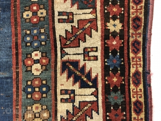 Early small Kazak. Spacious and fluid drawing. An older example of a well known design group. All natural colors. Overall even low pile with scattered wear, heavy brown oxidation and creases as  ...