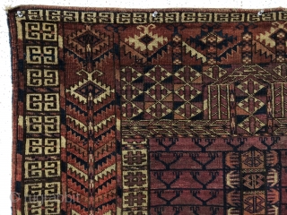 Antique tekke ensi. As found, very very dirty and with various holes and a corner rounding as shown. Mostly good pile with some light scattered wear. Colors appear natural with no color  ...