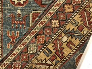 Antique small Caucasian rug in good condition with a dramatic design and attractive colors featuring a lovely yellow main border. The easily recognized karagashli type motifs and numerous animals float on a  ...