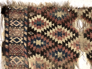 Antique unusual turkman rug fragment, perhaps chodor, with a tight lattice of ashik guls arranged in diagonal color rows on a dark brown ground. Persian knotted open to the right. Appears to  ...