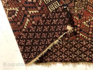 Antique tekke ensi. As found, very very dirty and with various holes and a corner rounding as shown. Mostly good pile with some light scattered wear. Colors appear natural with no color  ...