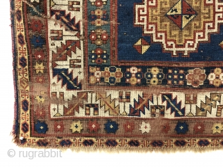 Early small Kazak. Spacious and fluid drawing. An older example of a well known design group. All natural colors. Overall even low pile with scattered wear, heavy brown oxidation and creases as  ...