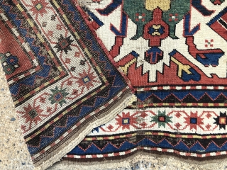 Early eagle karrabagh rug with outstanding color. Unfortunately in very rough condition. All excellent natural colors featuring brilliant yellows and greens. Wear and scattered damage as shown. Some old crude flat stitch  ...