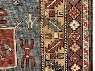 Antique small Caucasian rug in good condition with a dramatic design and attractive colors featuring a lovely yellow main border. The easily recognized karagashli type motifs and numerous animals float on a  ...