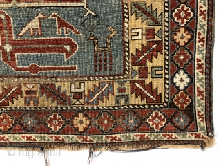 Antique small Caucasian rug in good condition with a dramatic design and attractive colors featuring a lovely yellow main border. The easily recognized karagashli type motifs and numerous animals float on a  ...