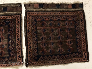 Antique original pair of Baluch bagfaces. Interesting and unusual horizontal use of Baluch tree motifs. Overall low pile with scattered heavy brown oxidation. Remnant rough selvages, rewrapped on one bagface. Original closure  ...