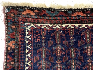 Antique little Baluch bagface with an array of unusual floral motifs on a rich blue ground. Good overall pile. All natural colors including nice light blues and a rich apricot orange. Selvages  ...