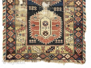 Early east Caucasian rug. Interesting karagashli variant. In rough condition with wear, oxidized browns, holes and edge loss. All natural colors featuring a strong yellow/gold and a fine old green. Good weave.  ...