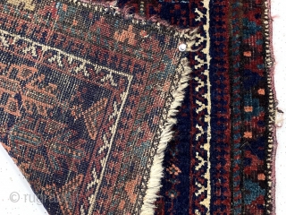 Antique little Baluch bagface with an array of unusual floral motifs on a rich blue ground. Good overall pile. All natural colors including nice light blues and a rich apricot orange. Selvages  ...