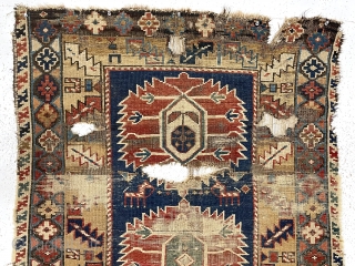 Early east Caucasian rug. Interesting karagashli variant. In rough condition with wear, oxidized browns, holes and edge loss. All natural colors featuring a strong yellow/gold and a fine old green. Good weave.  ...