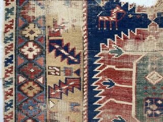 Early east Caucasian rug. Interesting karagashli variant. In rough condition with wear, oxidized browns, holes and edge loss. All natural colors featuring a strong yellow/gold and a fine old green. Good weave.  ...