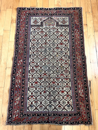 Small antique ivory ground shirvan prayer rug. Appears to have some corroded magenta silk highlights. Reasonably fine weave. Overall fair condition with low pile and scattered small spots of light wear as  ...