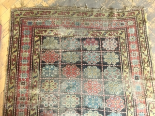 Antique rug. Unusual design. Northwest Persian? Caucasian? Mystery? Restorable. With wear and edge roughness as shown. Priced accordingly. Late 19th c. 4'3" x 8'6"         