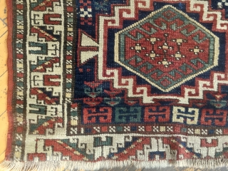 Antique kazak or Karabaugh rug. Interesting field. Fair condition. Even low pile. Good selvages. End loss as shown. Needs a wash. Charming little rug. Late 19th c. 3'3 x 5'5"   