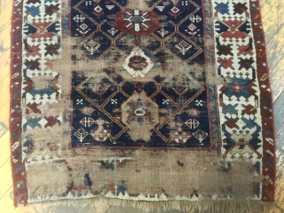 Antique long rug, possibly northwest Persian. Good quality rug in somewhat abused condition. Interesting field design and well drawn large scale  crab border. All natural colors. Large areas of wear, few  ...