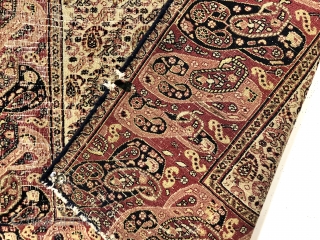 Antique small Persian rug with an appealing mother and daughter boteh border and an intricate ivory ground boteh lattice field. Unfortunately in rough condition with very low pile and much wear. Edges  ...