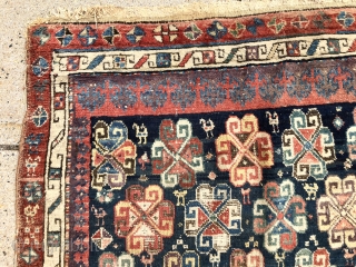 Early tribal rug fragment, probably northwest Persian with an interesting design featuring large memling guls and colorful endless knots. Add in many little animals and you have quite a charming weaving. All  ...