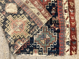 Early tribal rug fragment, probably northwest Persian with an interesting design featuring large memling guls and colorful endless knots. Add in many little animals and you have quite a charming weaving. All  ...