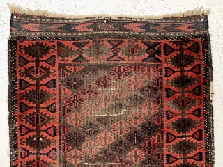 Antique little Baluch rug with an attractive uncommon border. Classic tile design field. All natural color featuring a deep rich red. Nice kelim ends. Wear and creases as shown. Substantial black oxidation.  ...